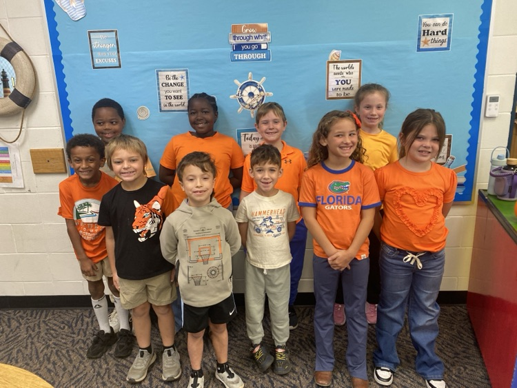 students wearing orange 