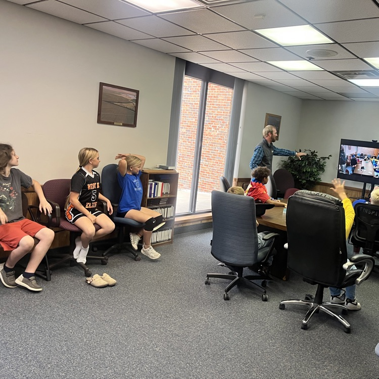 Fifth graders leaning about the conference room at Dayspring Bank!