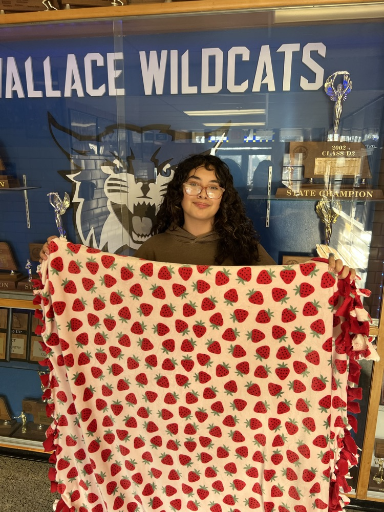 Michelle donating her blanket she made  