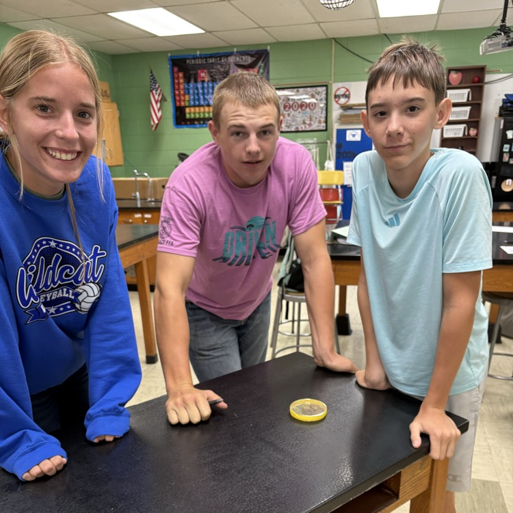 Heidi, Colby, and Ethan looking at the bacteria from their cell phones. gross 🤢 