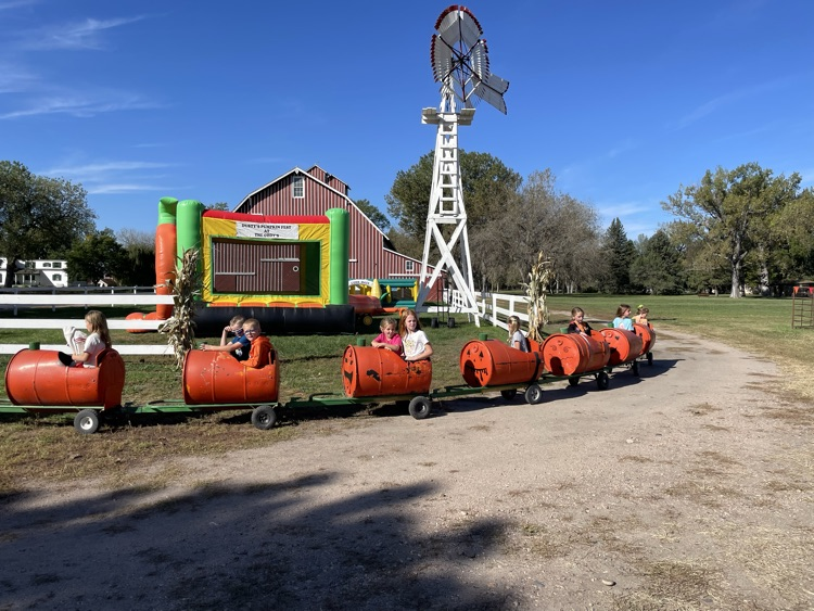 pumpkin train with students in the cars