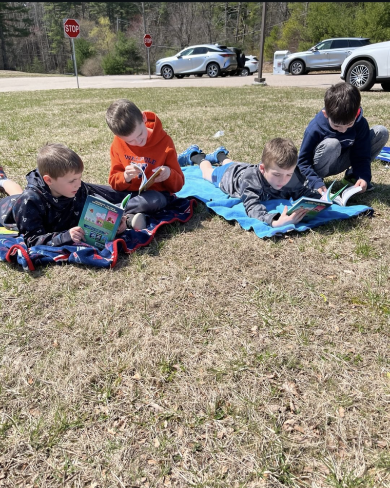 2nd graders reading outside