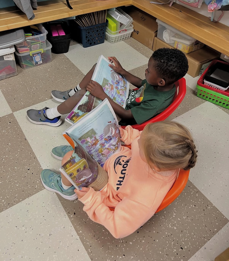 two students reading together