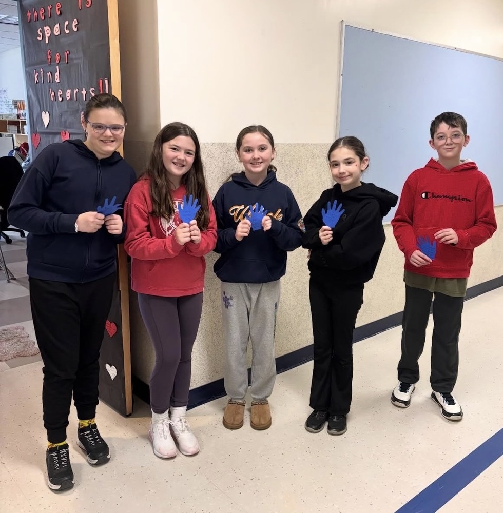 Grade 5 students with their high fives