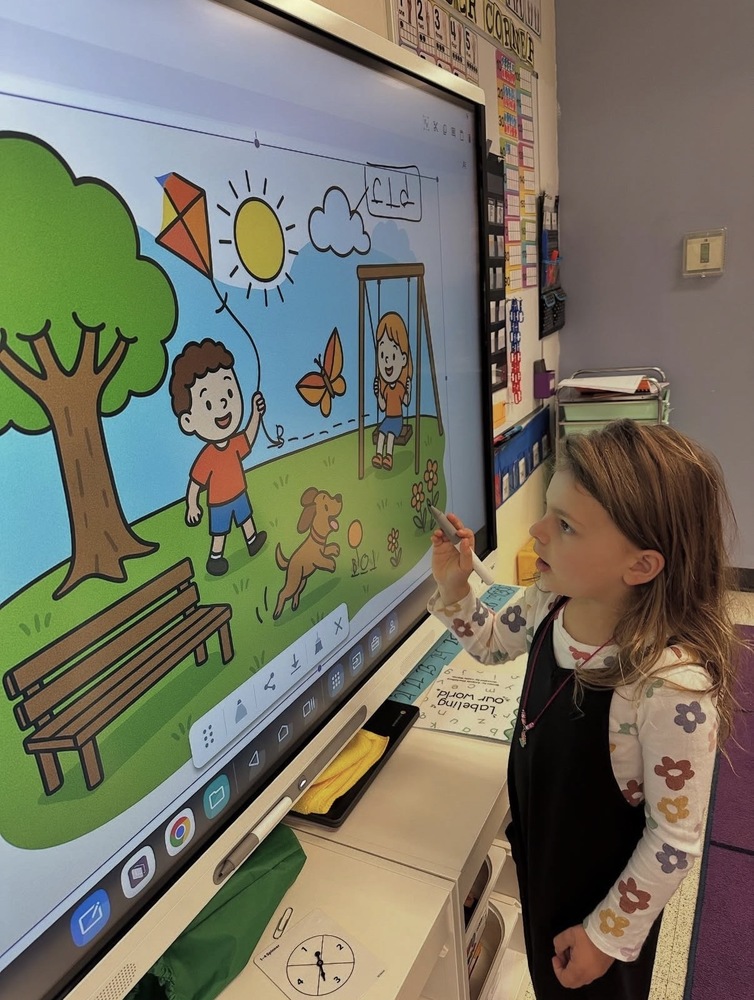 kindergarten student at the smartboard