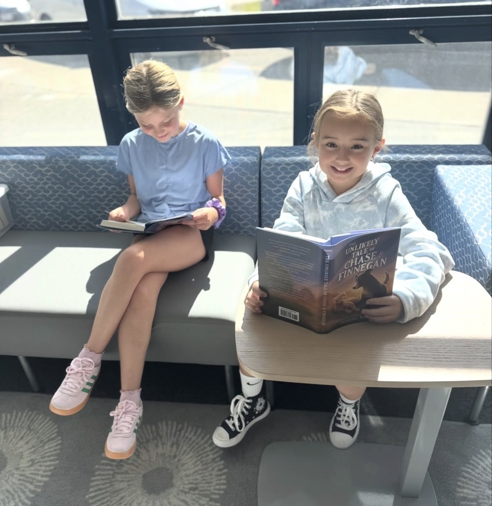 two students reading together in STEM class