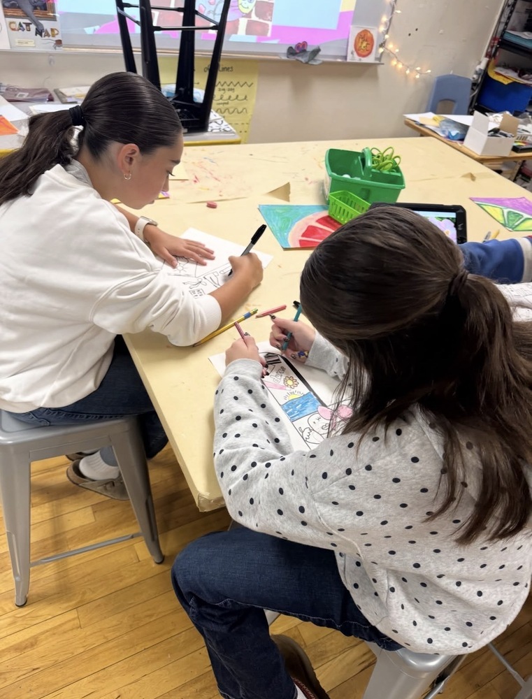 2 grade 5 students working in the Art room