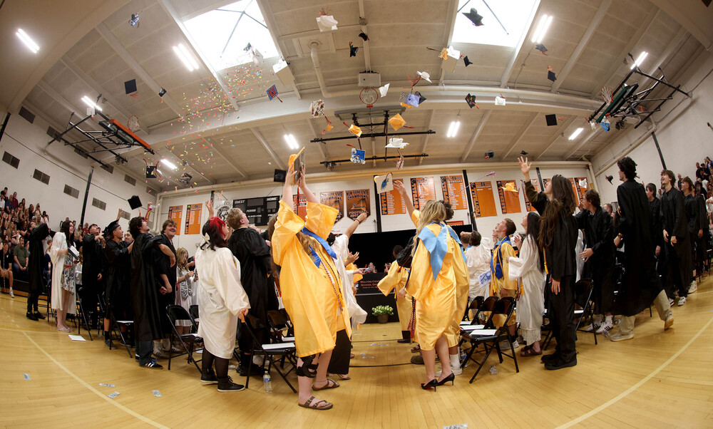 Graduates tossing their caps