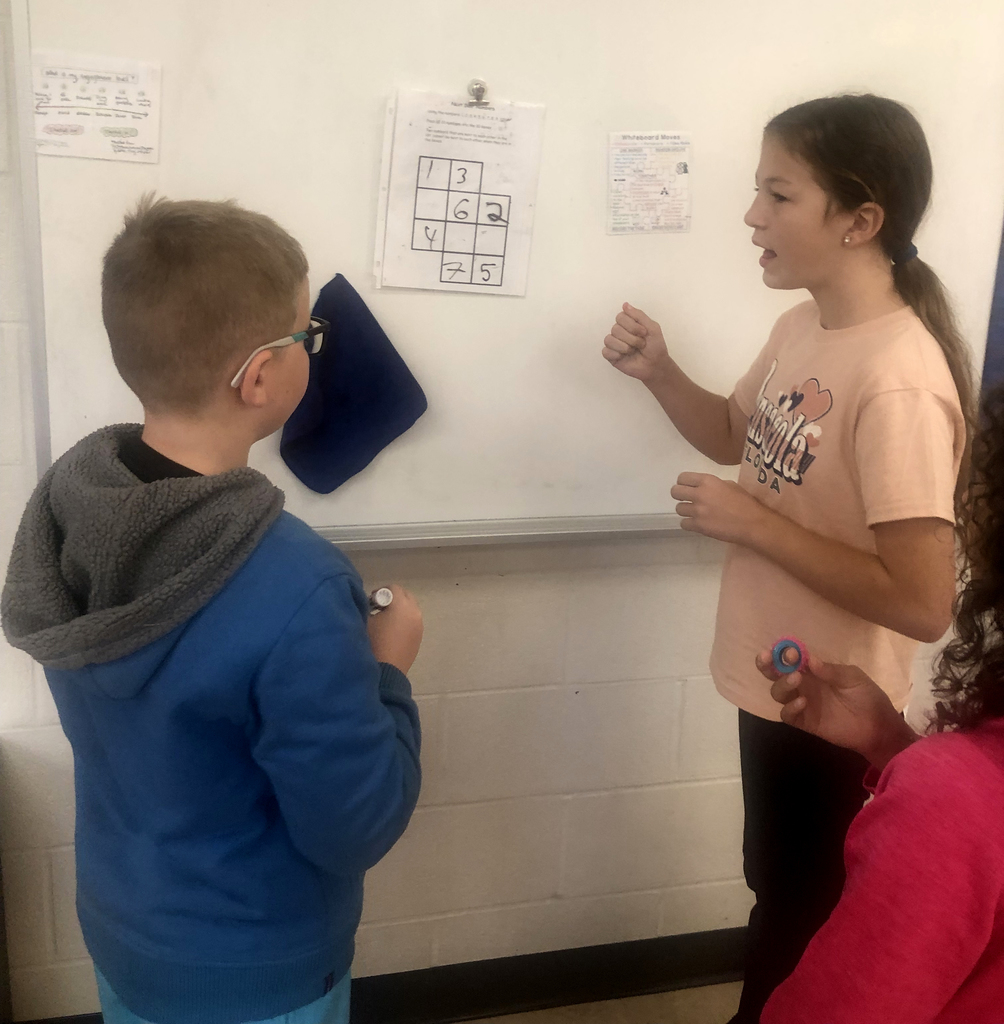 Students working together in the classroom. 