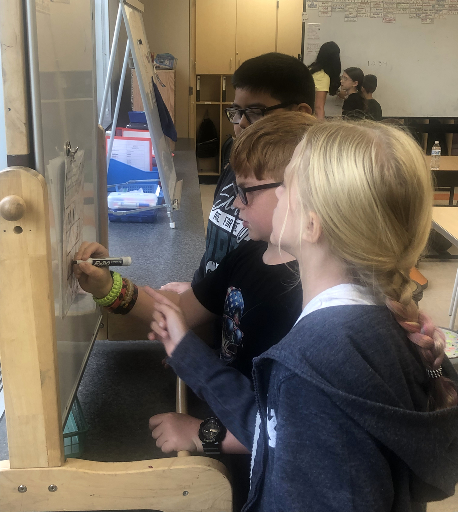Students working together in the classroom. 