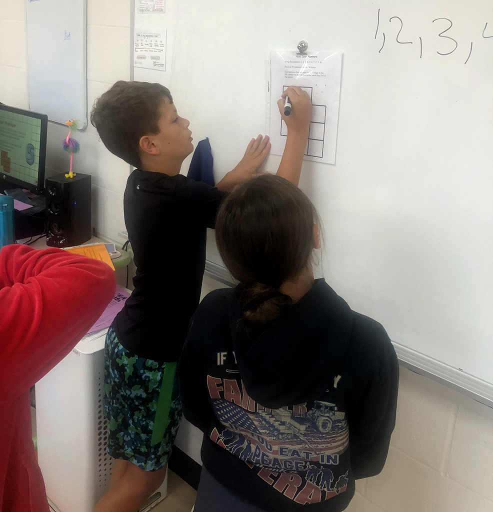 Students working together in the classroom. 