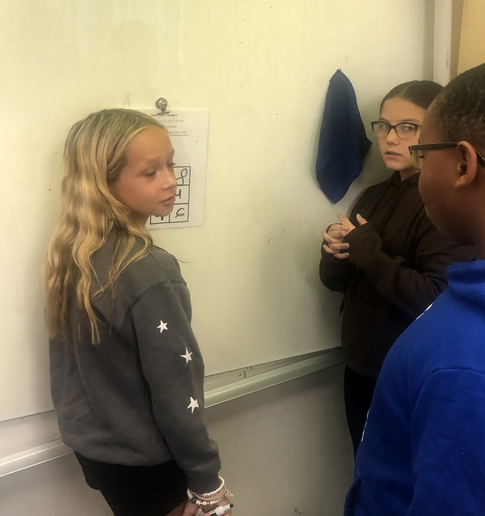Students working together in the classroom. 