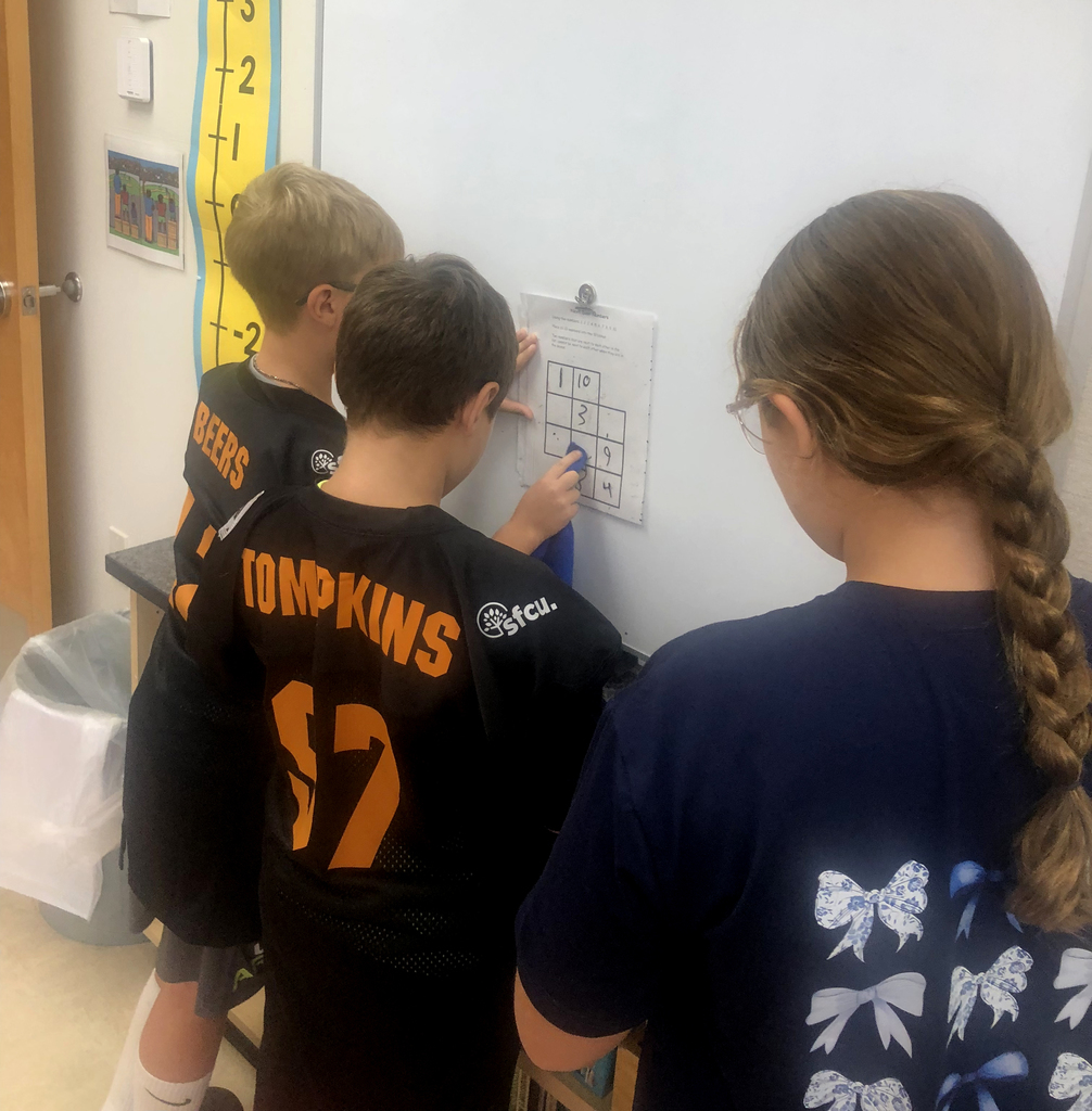Students working together in the classroom. 