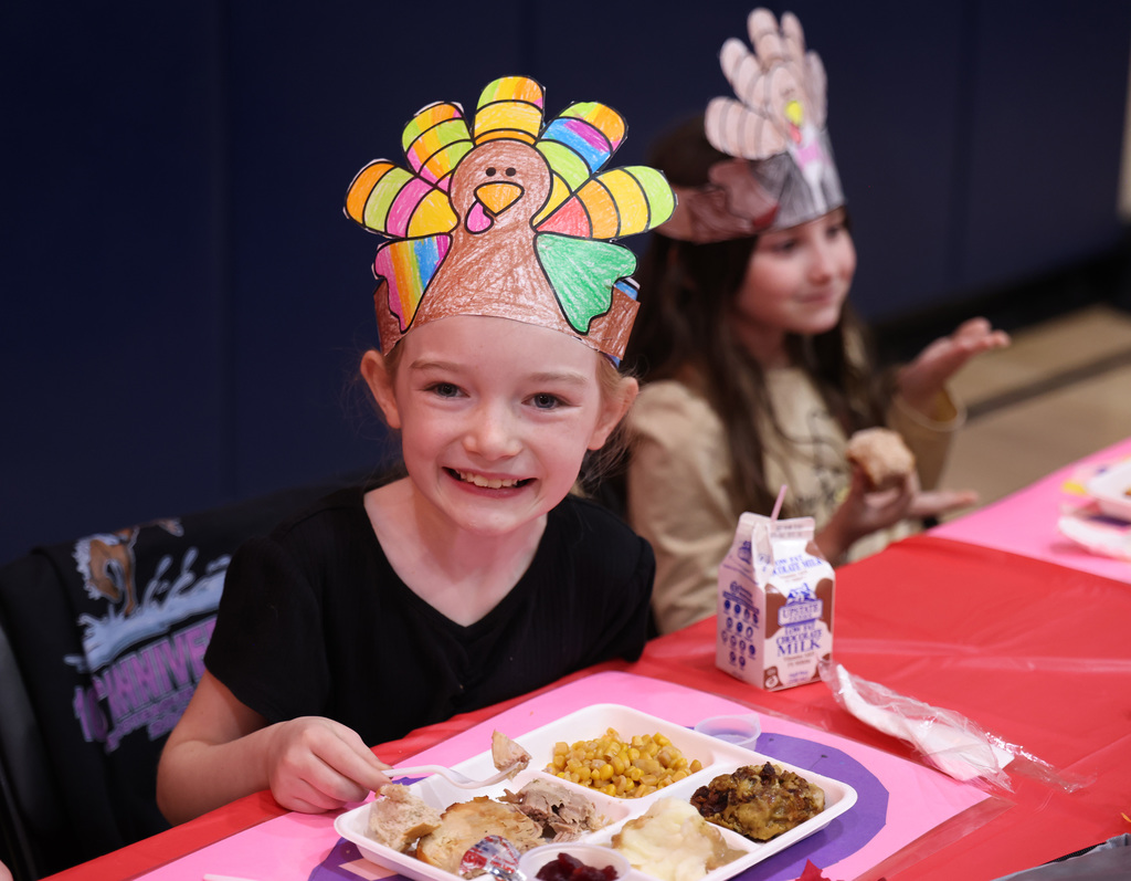 Students enjoying the second-grade Thanksgiving feast. 