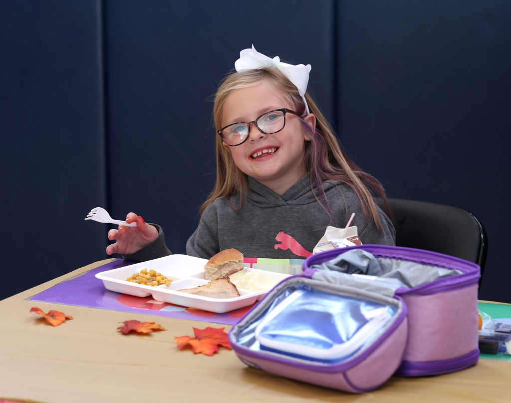 Students enjoying the second-grade Thanksgiving feast. 