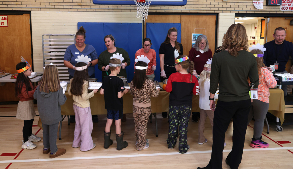 Students enjoying the second-grade Thanksgiving feast. 