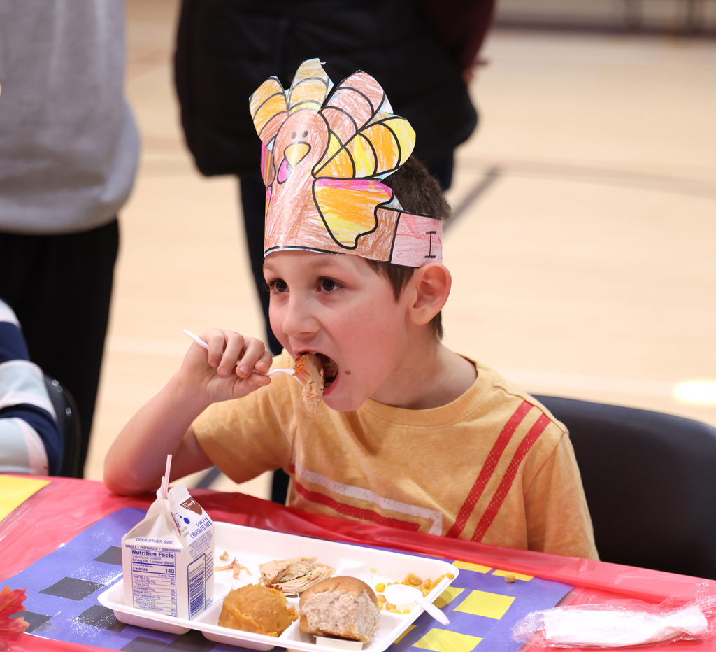 Students enjoying the second-grade Thanksgiving feast. 