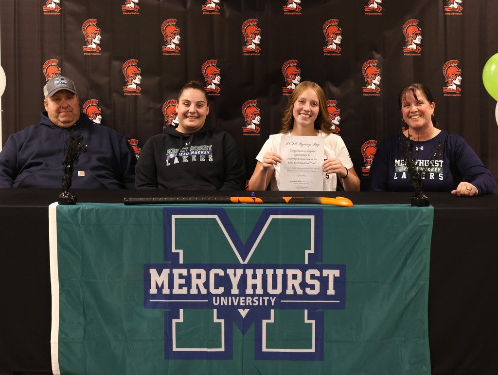 Kylie Wood signing her letter to play Division I field hockey