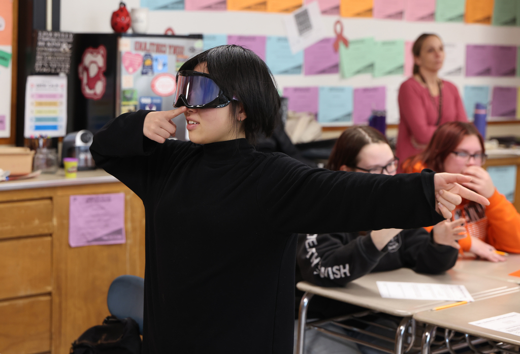 Students taking part in different stations during the health class lesson. 