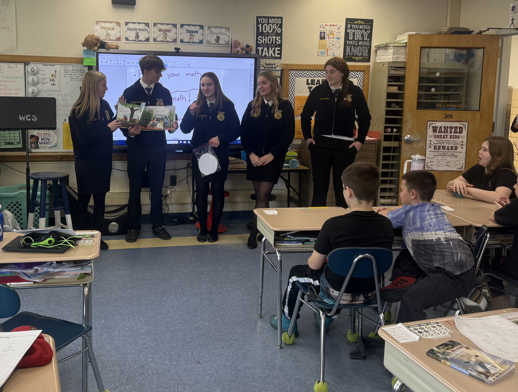 FFA/agriculture students speaking to elementary students