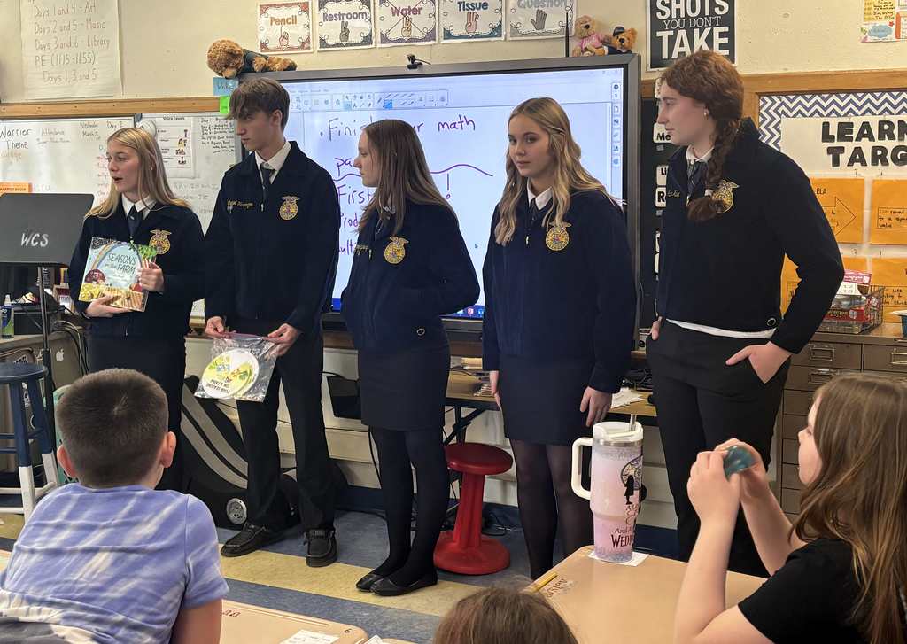 FFA/agriculture students speaking to elementary students