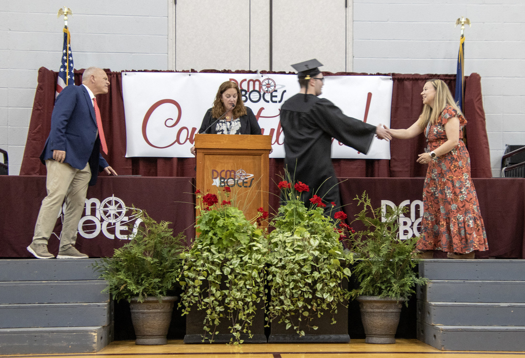 Handshake after receiving diploma