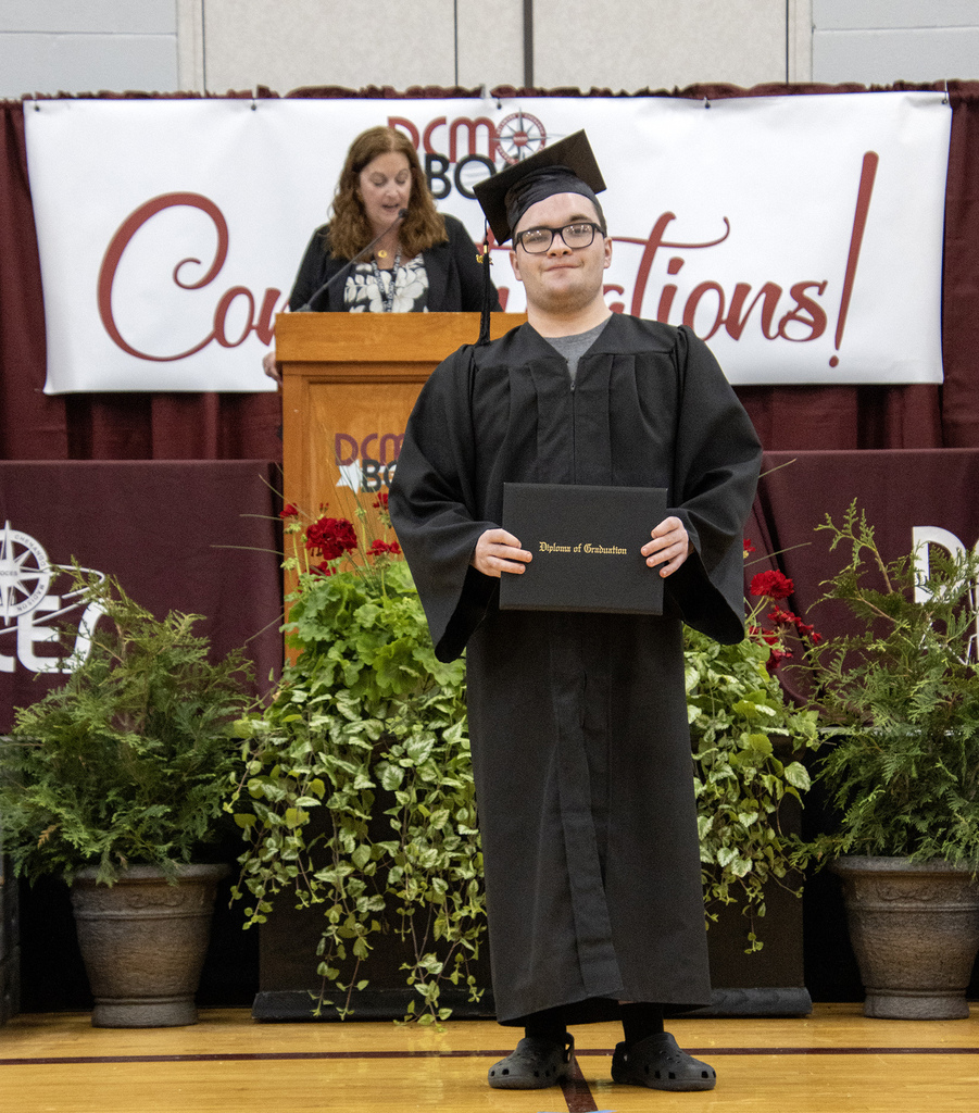 With his diploma