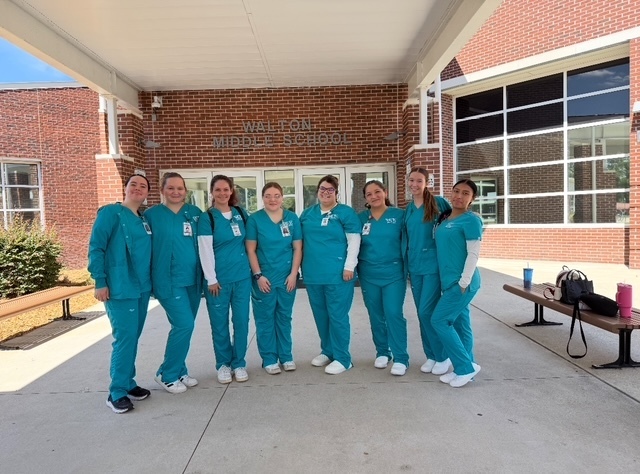 PCT students helping with health screenings at WMS