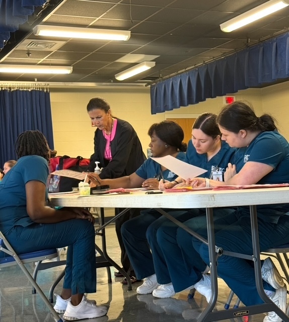 PN students helping with health screenings at WMS