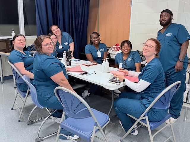 PN students enrolled at Emerald Coast Technical College @ Magnet Innovation Center - Watersound helping with student health screenings at Walton Middle School in DeFuniak Springs. 