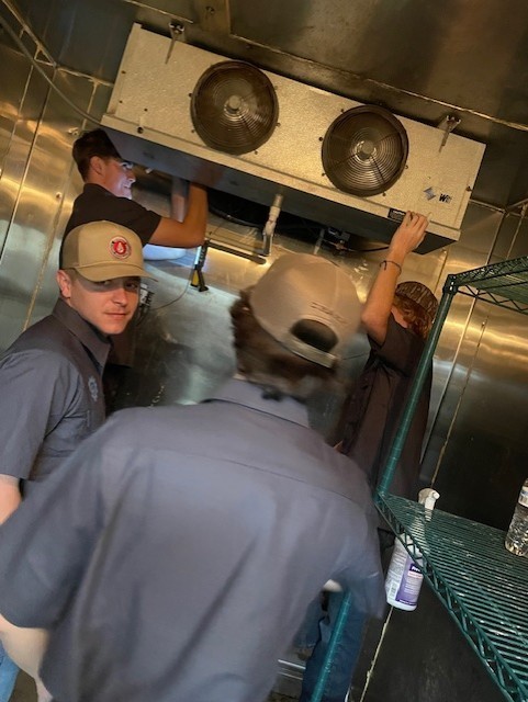 HVAC/R students working on a cooler