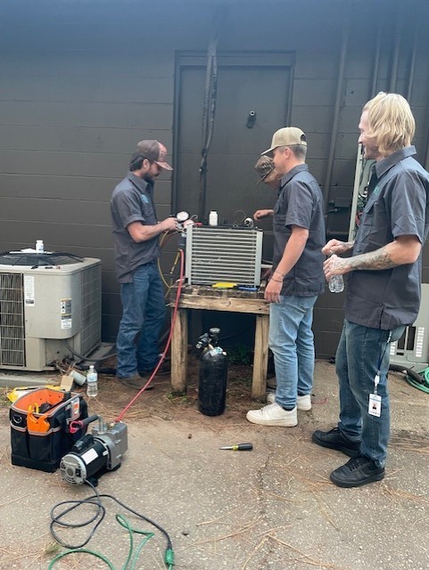 HVAC/R students working on a cooler