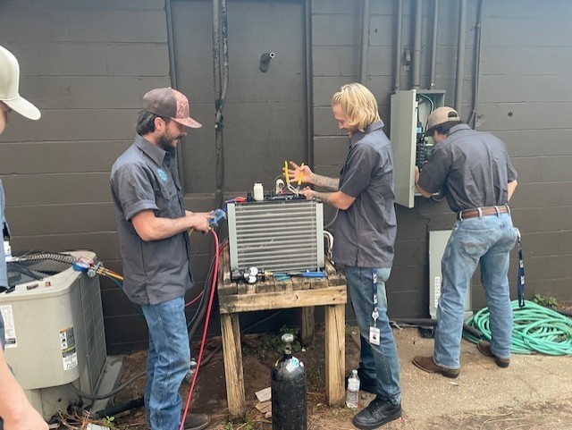 HVAC/R students working on a cooler