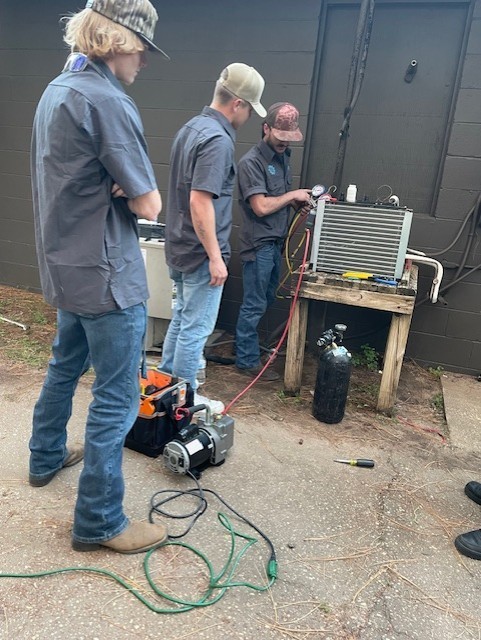 HVAC/R students working on a cooler