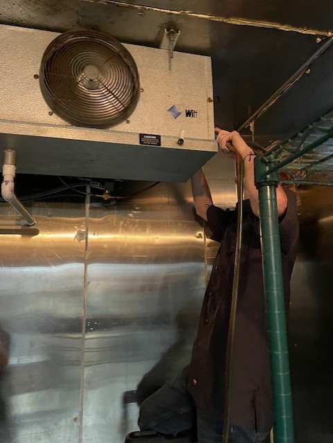 HVAC/R students working on a cooler