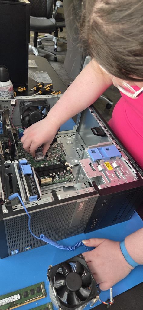 AIT student participating in a P.C. teardown and rebuild project.