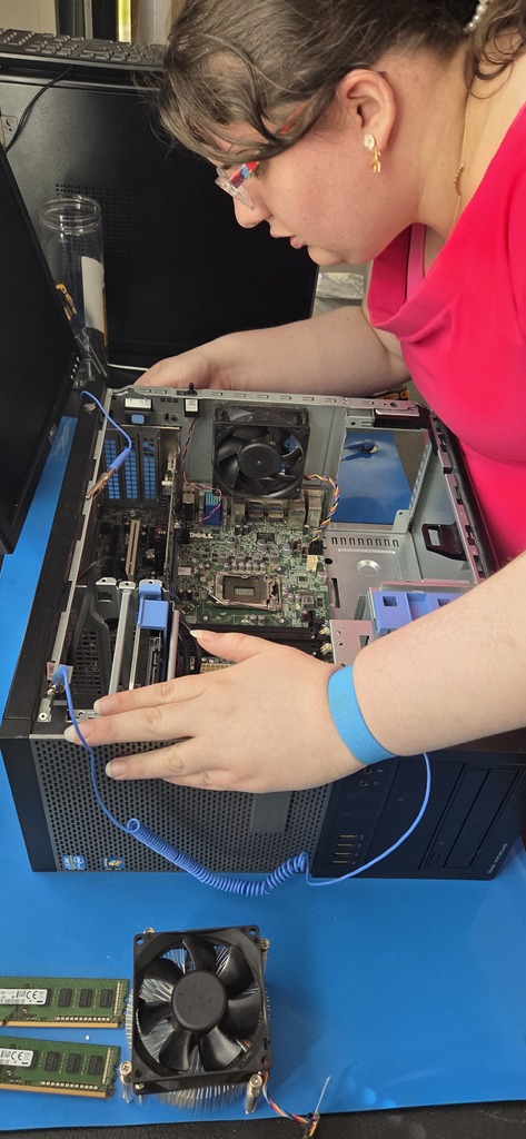 AIT student participating in a P.C. teardown and rebuild project.