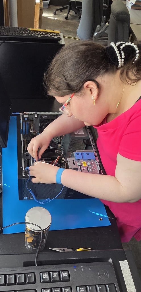 AIT student participating in a P.C. teardown and rebuild project.