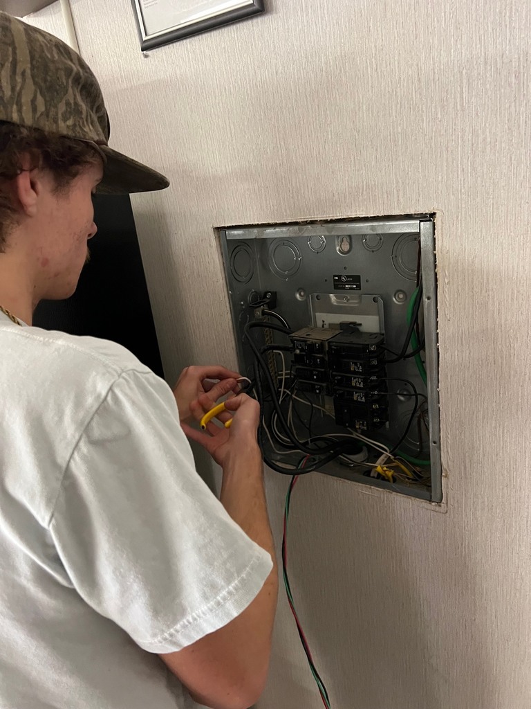 ECTC Electricity students working at The Academy.