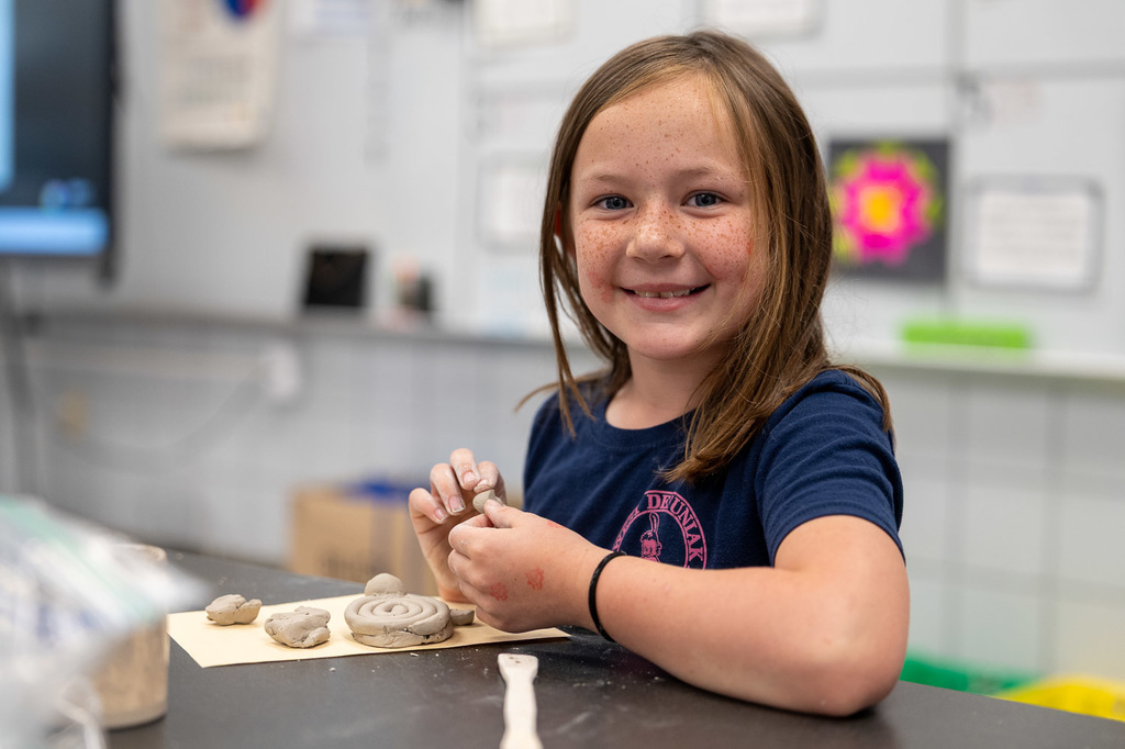 student smiles for the camera