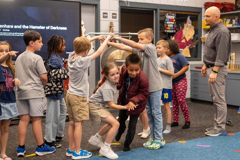 students dance to music