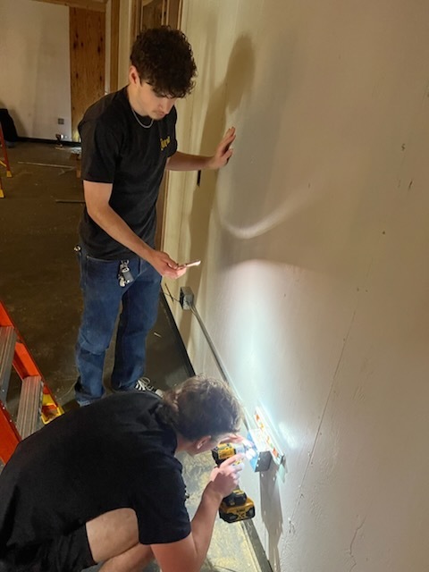 Electricity students at ECTC working in the community. 