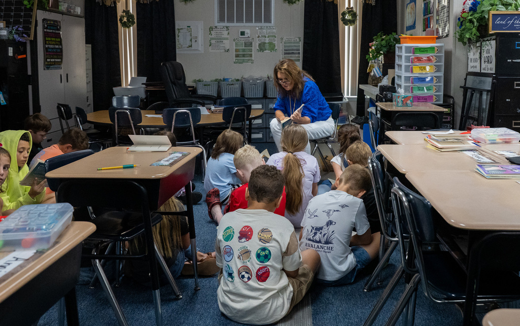 students listening to teacher read