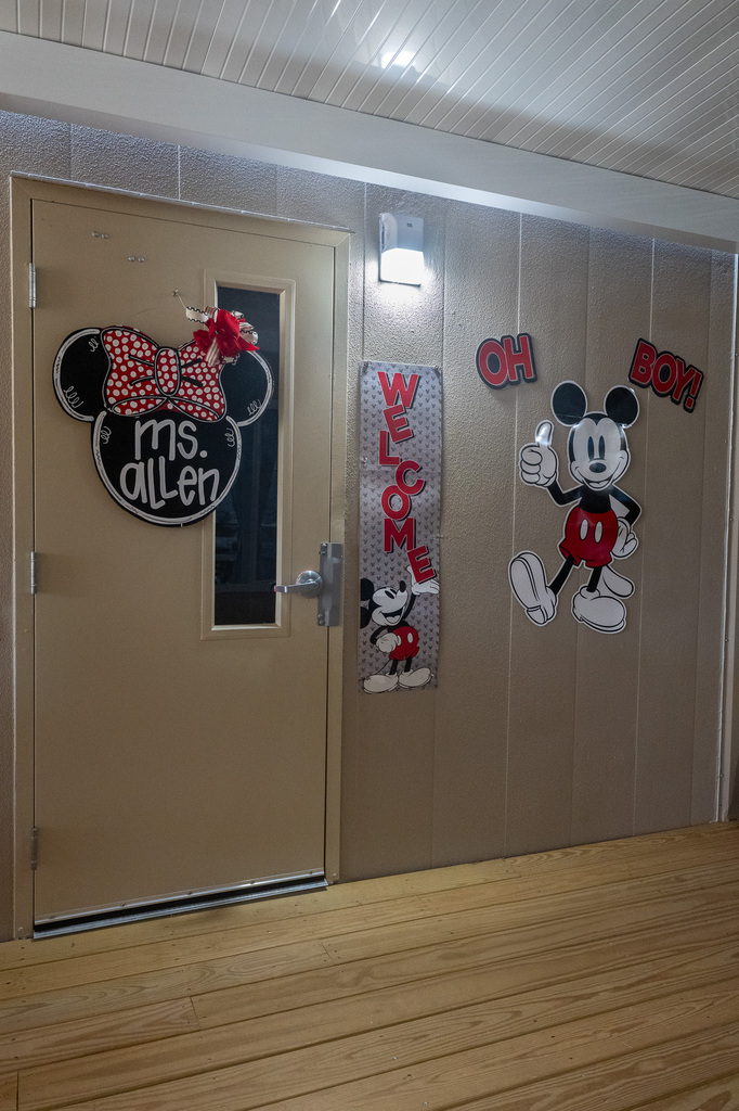 classroom door decorated with Disney character