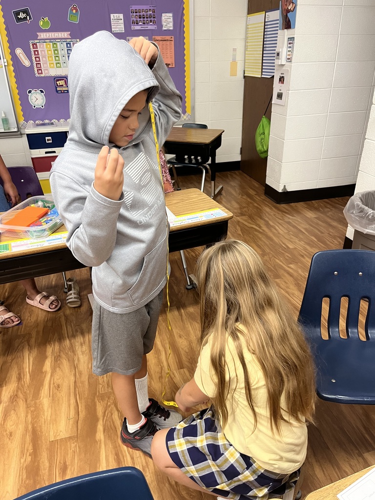 Third grade students learn how to use a tape measure in a fun activity working in pairs to measure lengths such as “wing span” among other things!