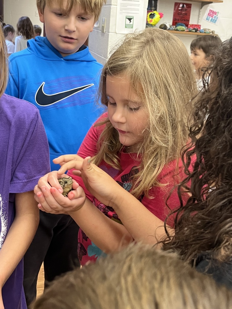 children holding toad
