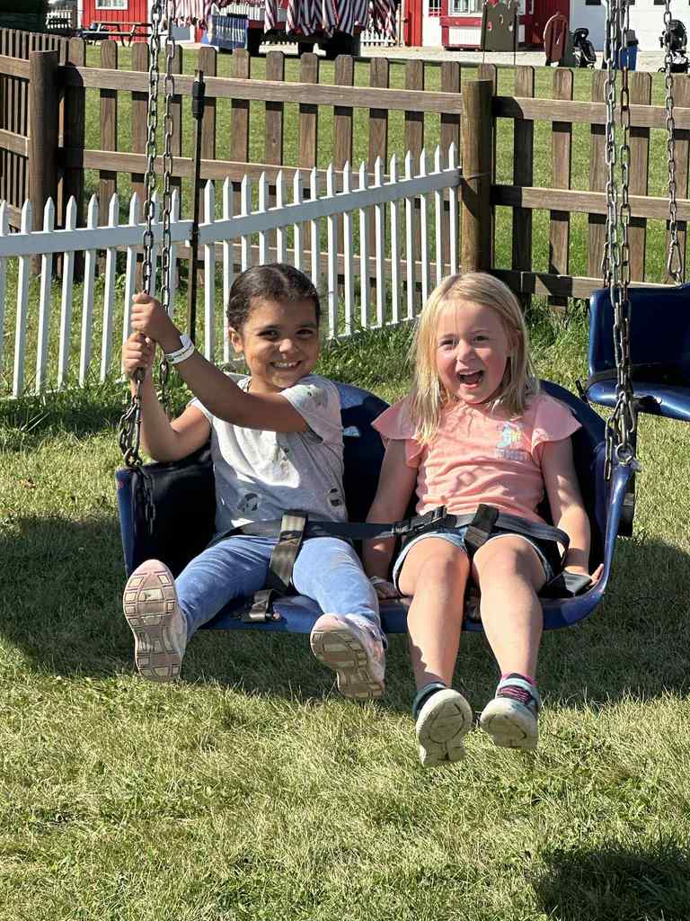 2 students on a swing