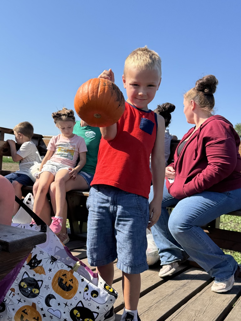 One student with a pumpkin