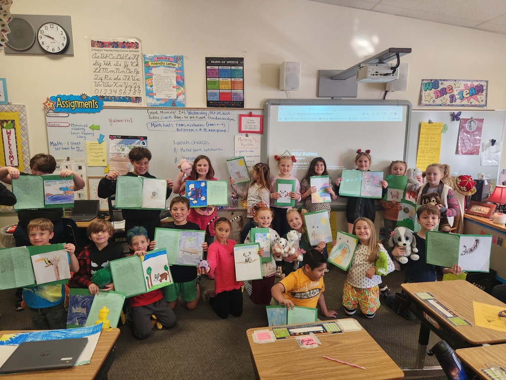 students with writing and stuffed animals