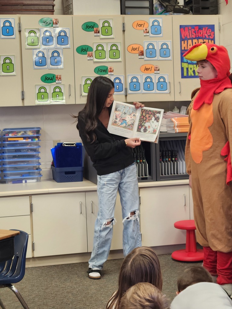 Student council sharing a Thanksgiving book